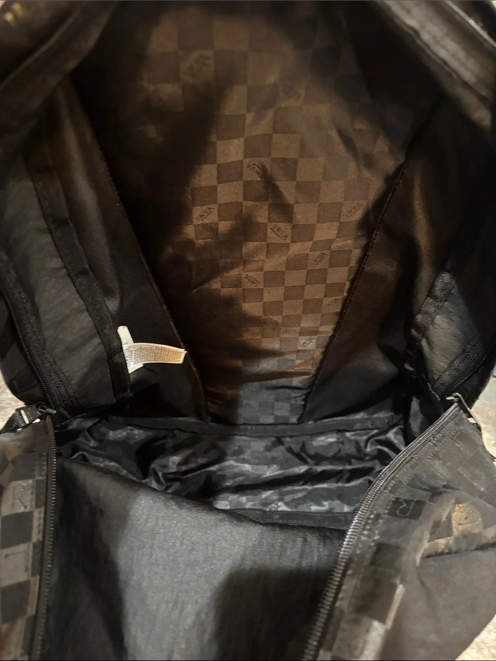 Vans Black Backpack with White Snake Crest and Checker Trim